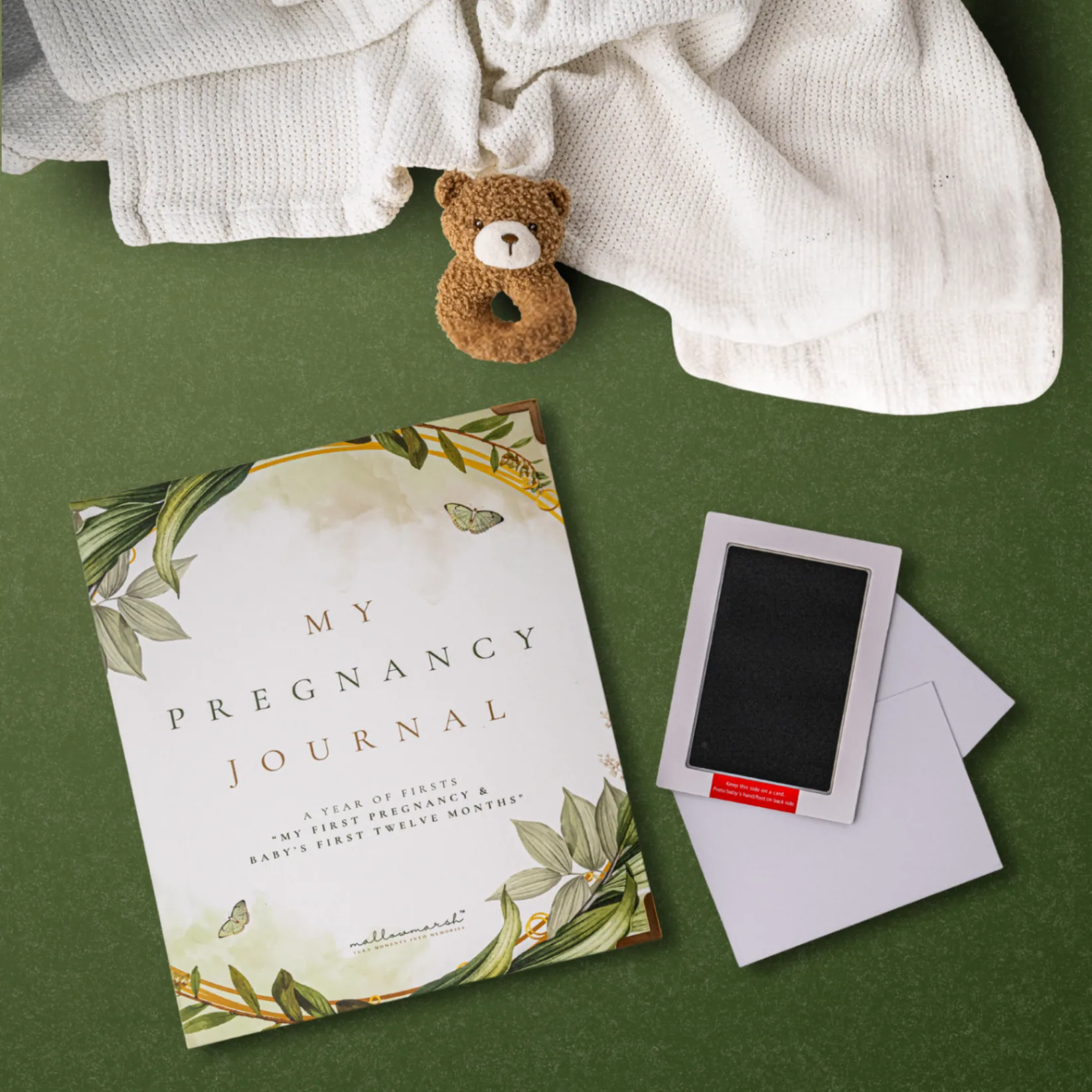 MallowMarsh™ Pregnancy Journal and Clean Touch Ink Pad styled as a gift with a knit blanket and teddy